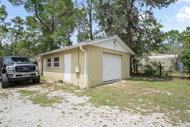 13345 Convent Garden Rd, Brooksville, FL 34613 - detached garage featuring driveway
