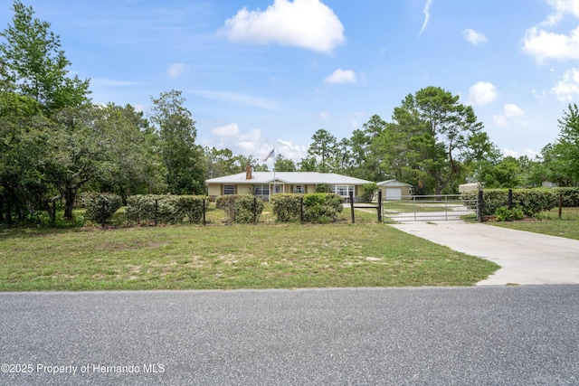 13345 Convent Garden Rd, Brooksville, FL 34613 - ranch-style house with a gate, driveway, and view of scattered trees