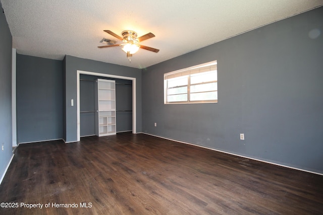6275 Casson St, Brooksville, FL 34604 - unfurnished bedroom featuring dark wood-style flooring, a closet, and a ceiling fan