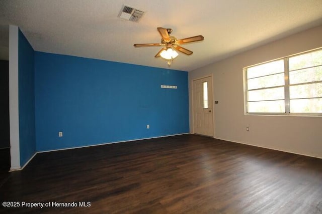 6275 Casson St, Brooksville, FL 34604 - spare room featuring dark wood-type flooring and a ceiling fan