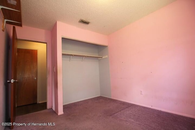 6275 Casson St, Brooksville, FL 34604 - unfurnished bedroom with carpet flooring, a closet, and a textured ceiling