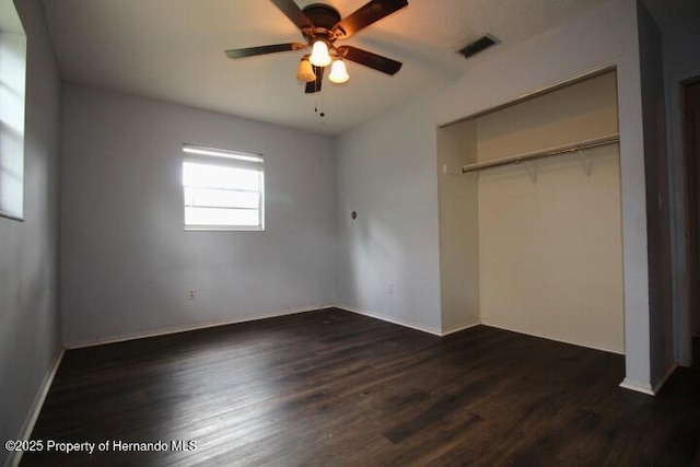 6275 Casson St, Brooksville, FL 34604 - unfurnished bedroom with dark wood-style flooring, a closet, and a ceiling fan