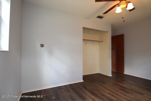 6275 Casson St, Brooksville, FL 34604 - unfurnished bedroom with dark wood-style flooring, a closet, and a ceiling fan