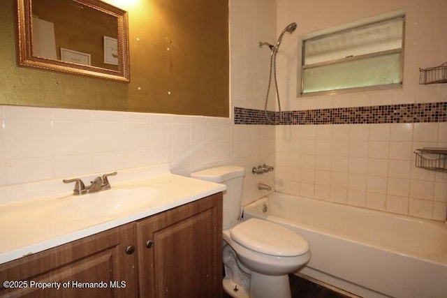 6275 Casson St, Brooksville, FL 34604 - bathroom with tile walls, vanity, and bathtub / shower combination