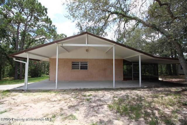 6275 Casson St, Brooksville, FL 34604 - back of property featuring a carport