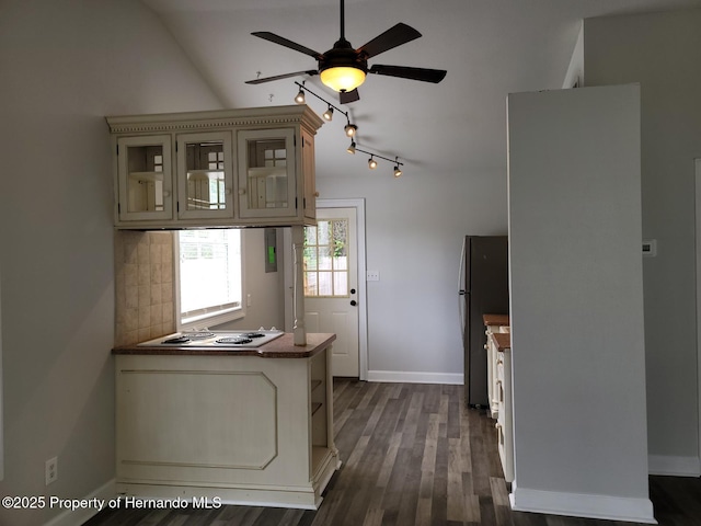 18499 Shady Side Dr, Brooksville, FL 34601 - kitchen featuring electric stovetop, ceiling fan, freestanding refrigerator, a peninsula, and glass insert cabinets