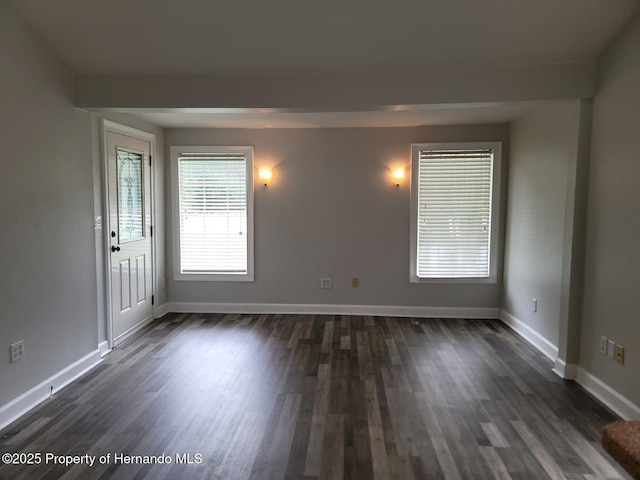 18499 Shady Side Dr, Brooksville, FL 34601 - empty room with dark wood-style flooring