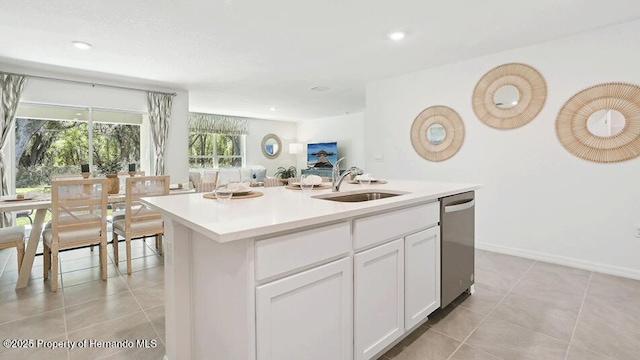 7163 N Folgers Ter, Dunnellon, FL 34433 - kitchen with dishwasher, white cabinetry, a kitchen island with sink, light countertops, and open floor plan