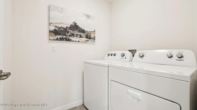 7163 N Folgers Ter, Dunnellon, FL 34433 - washroom with washer and clothes dryer and baseboards