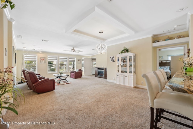 13027 Beacon Ct, Hudson, FL 34667 - carpeted living room with crown molding and a ceiling fan