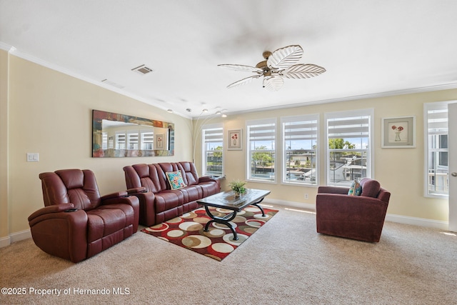13027 Beacon Ct, Hudson, FL 34667 - carpeted living room featuring ornamental molding, a ceiling fan, and plenty of natural light