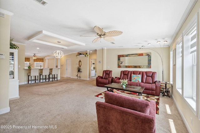 13027 Beacon Ct, Hudson, FL 34667 - living room with plenty of natural light, carpet flooring, and crown molding