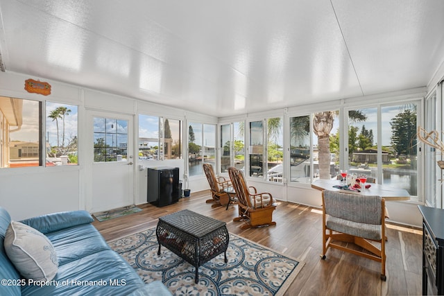 13027 Beacon Ct, Hudson, FL 34667 - sunroom featuring wood finished floors and a deck