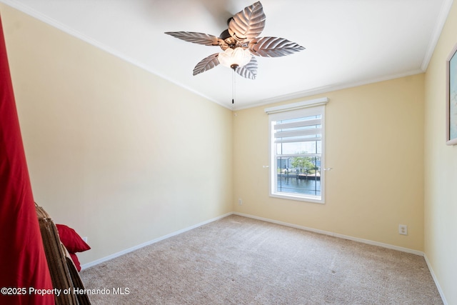 13027 Beacon Ct, Hudson, FL 34667 - empty room featuring carpet floors, crown molding, and a ceiling fan