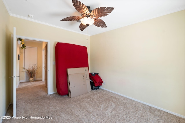 13027 Beacon Ct, Hudson, FL 34667 - unfurnished bedroom featuring carpet floors, ornamental molding, and ceiling fan