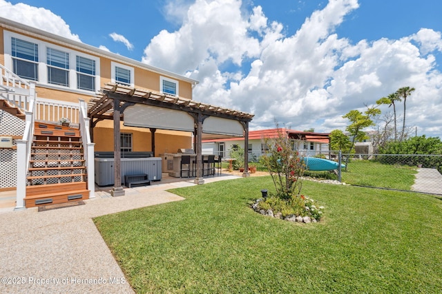 13027 Beacon Ct, Hudson, FL 34667 - back of house featuring a pergola, a patio area, stucco siding, and a hot tub