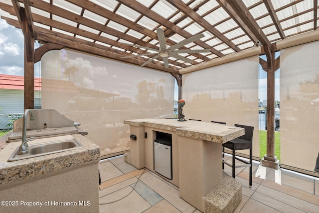 13027 Beacon Ct, Hudson, FL 34667 - view of patio / terrace featuring an outdoor kitchen, a pergola, and ceiling fan