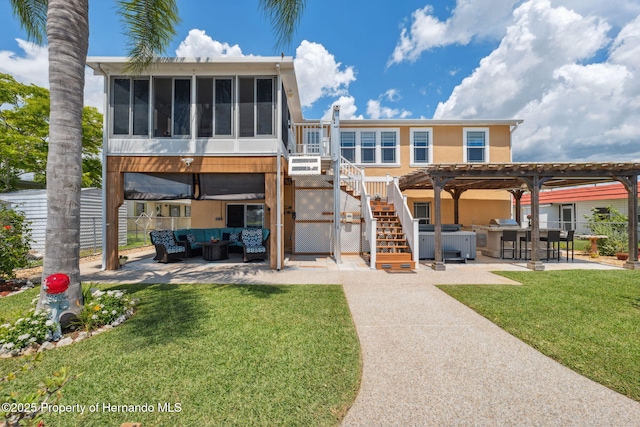 13027 Beacon Ct, Hudson, FL 34667 - back of property featuring outdoor lounge area, a patio area, a sunroom, and stairway