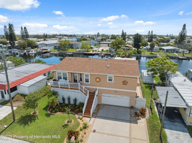 13027 Beacon Ct, Hudson, FL 34667 - aerial perspective of suburban area featuring a large body of water