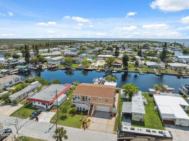 13027 Beacon Ct, Hudson, FL 34667 - aerial perspective of suburban area with a large body of water