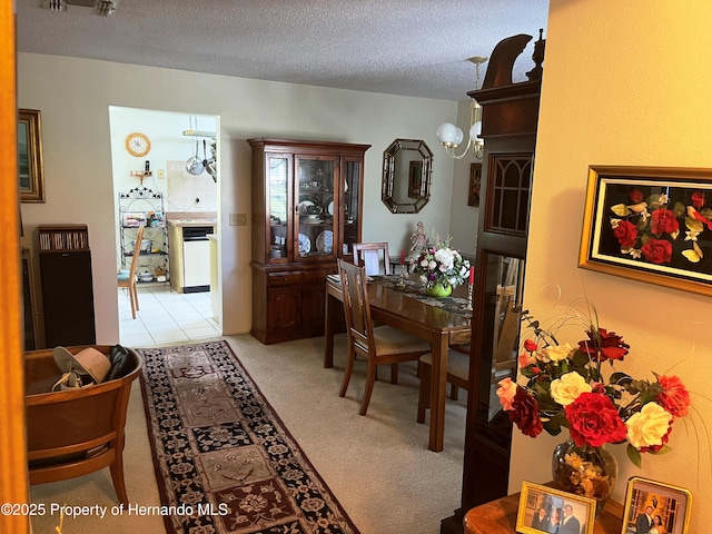 9474 Nakoma Way, Weeki Wachee, FL 34613 - dining area featuring light colored carpet and a textured ceiling