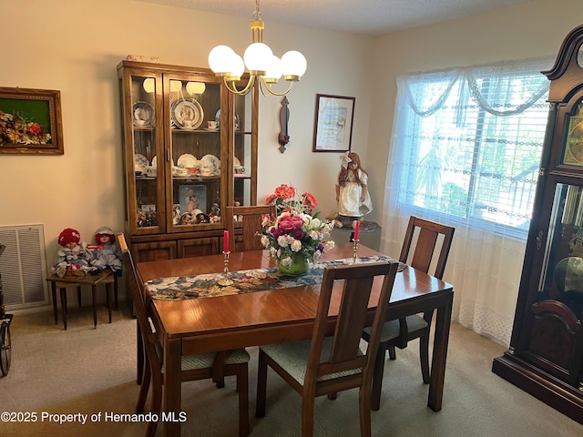 9474 Nakoma Way, Weeki Wachee, FL 34613 - dining area featuring healthy amount of natural light, a chandelier, and light colored carpet