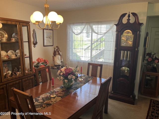 9474 Nakoma Way, Weeki Wachee, FL 34613 - carpeted dining space with a chandelier