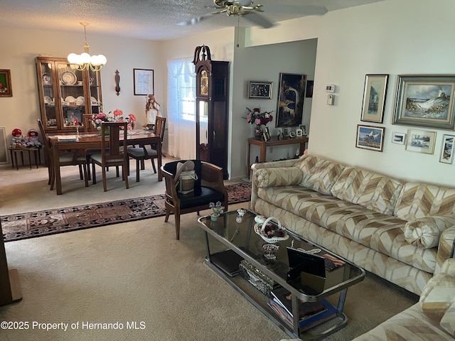 9474 Nakoma Way, Weeki Wachee, FL 34613 - carpeted living area featuring ceiling fan, a chandelier, and a textured ceiling