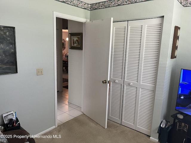 9474 Nakoma Way, Weeki Wachee, FL 34613 - tiled bedroom with a closet and carpet