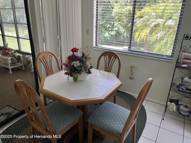 9474 Nakoma Way, Weeki Wachee, FL 34613 - tiled dining space with plenty of natural light