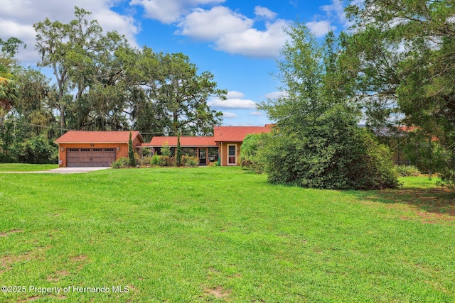 20480 Lake Lindsey Rd, Brooksville, FL 34601 - view of front of house with a garage, a front yard, and driveway