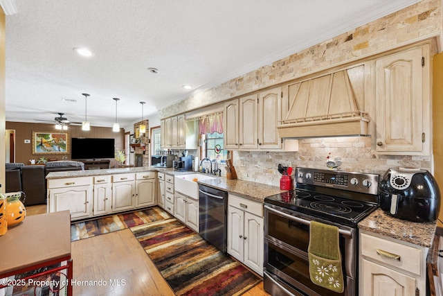 20480 Lake Lindsey Rd, Brooksville, FL 34601 - kitchen with stainless steel appliances, dark wood-style floors, ceiling fan, crown molding, and a peninsula