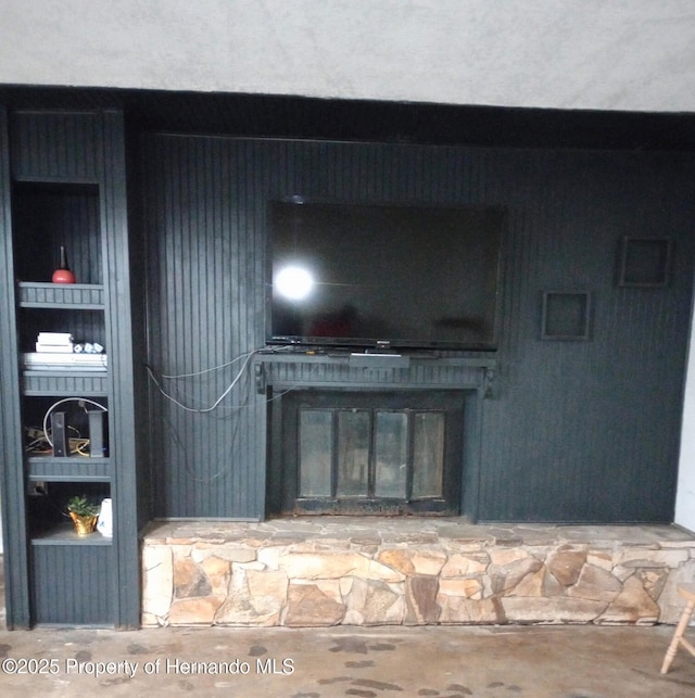 2419 Appian Ave, Spring Hill, FL 34608 - detailed view of concrete floors and a stone fireplace