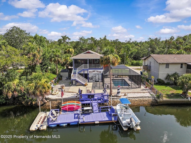 6241 Colony Cir, Weeki Wachee, FL 34607 - dock featuring a water view, a patio area, stairs, and a lanai