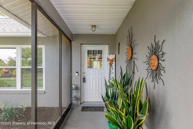 2295 Rio Cir, Spring Hill, FL 34608 - property entrance with stucco siding