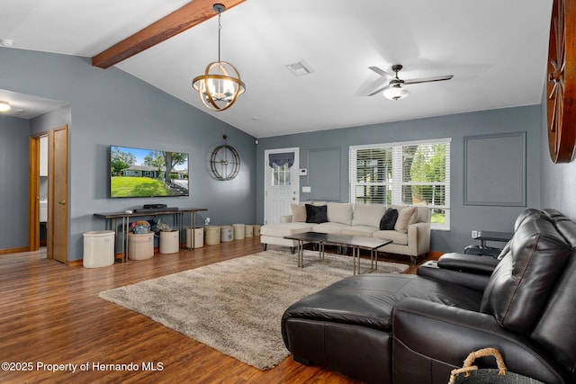 2295 Rio Cir, Spring Hill, FL 34608 - living area featuring wood finished floors, ceiling fan, and a chandelier