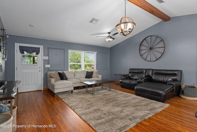 2295 Rio Cir, Spring Hill, FL 34608 - living area featuring a chandelier, healthy amount of natural light, a ceiling fan, and dark wood-type flooring