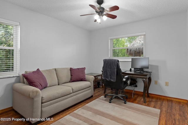 2295 Rio Cir, Spring Hill, FL 34608 - office space featuring plenty of natural light, wood finished floors, a ceiling fan, and a textured ceiling
