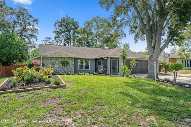 2295 Rio Cir, Spring Hill, FL 34608 - single story home with stone siding and a sunroom
