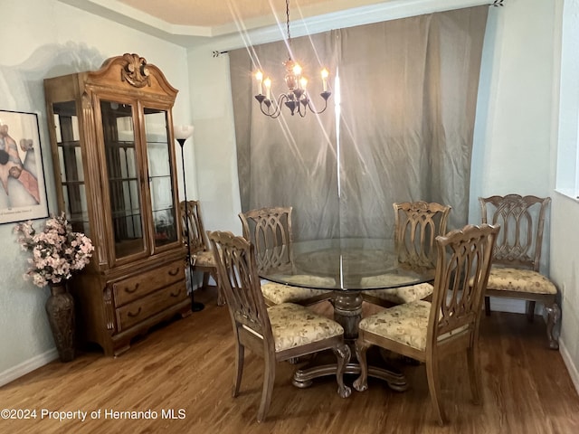 5388 Idleweise Ct, Spring Hill, FL 34606 - dining room with wood finished floors and a chandelier