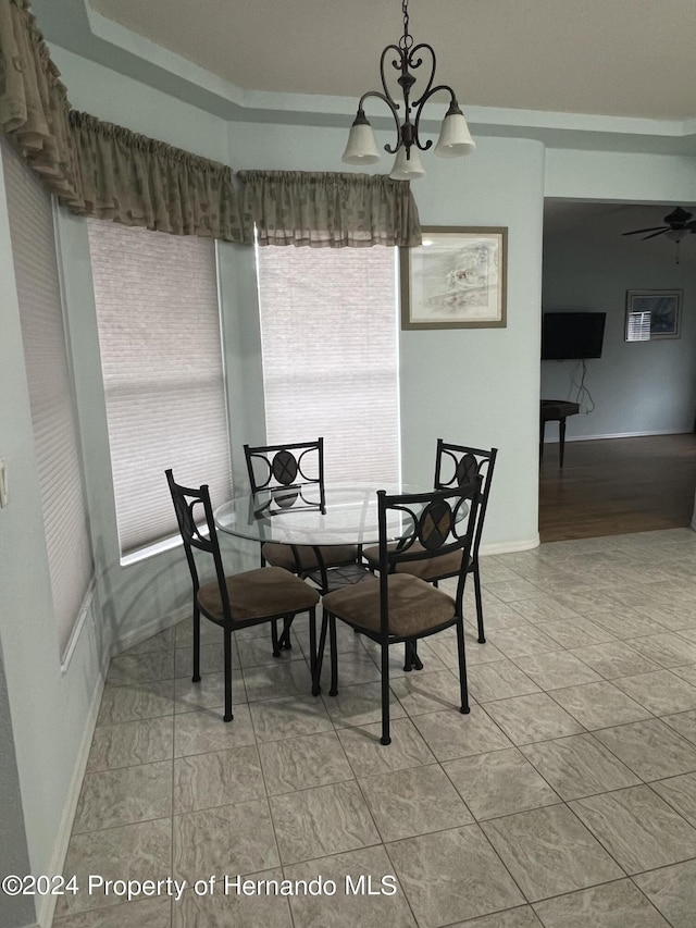 5388 Idleweise Ct, Spring Hill, FL 34606 - dining space featuring baseboards and a chandelier