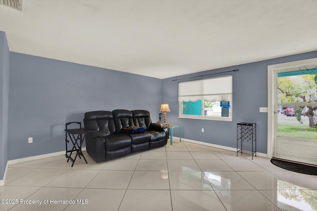 13332 Lisa Dr, Hudson, FL 34667 - tiled living area featuring baseboards