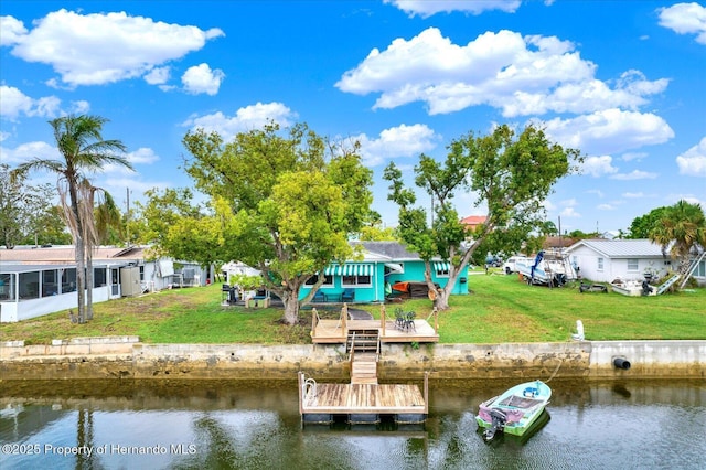 13332 Lisa Dr, Hudson, FL 34667 - dock featuring a water view and a lawn