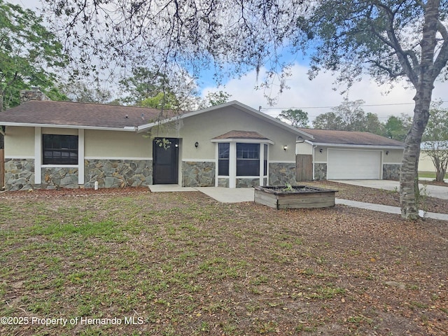 18232 Monteverde Dr, Spring Hill Pasco, FL 34610 - view of front of home with stone siding, stucco siding, an attached garage, driveway, and a chimney