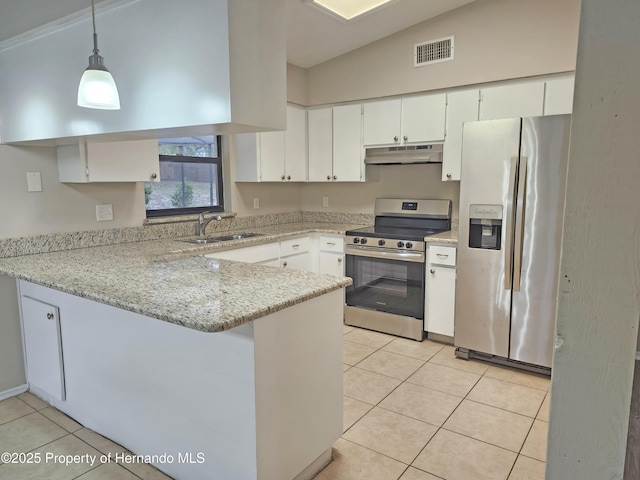 18232 Monteverde Dr, Spring Hill Pasco, FL 34610 - kitchen featuring appliances with stainless steel finishes, under cabinet range hood, a peninsula, light tile patterned flooring, and white cabinets