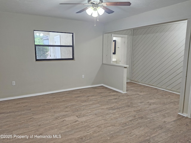 18232 Monteverde Dr, Spring Hill Pasco, FL 34610 - spare room featuring wood finished floors and a ceiling fan