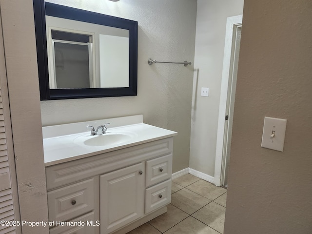 18232 Monteverde Dr, Spring Hill Pasco, FL 34610 - bathroom with vanity, tile patterned floors, and a textured wall