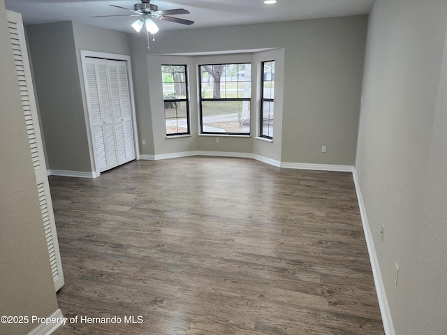 18232 Monteverde Dr, Spring Hill Pasco, FL 34610 - unfurnished bedroom featuring dark wood finished floors, a closet, ceiling fan, and recessed lighting