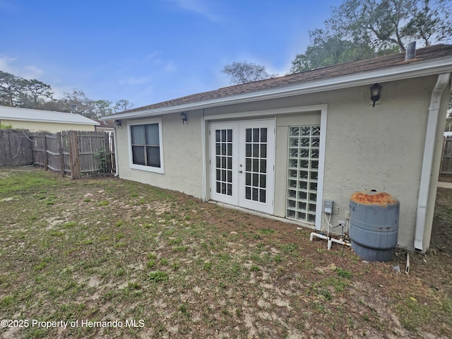 18232 Monteverde Dr, Spring Hill Pasco, FL 34610 - back of property with stucco siding and french doors