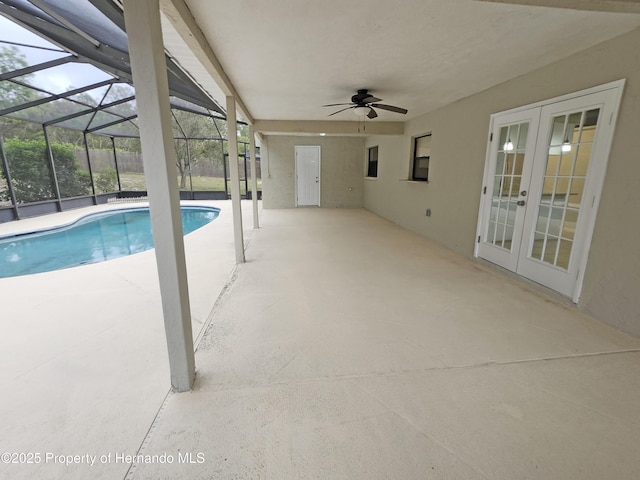 18232 Monteverde Dr, Spring Hill Pasco, FL 34610 - swimming pool featuring french doors, a patio area, ceiling fan, and glass enclosure